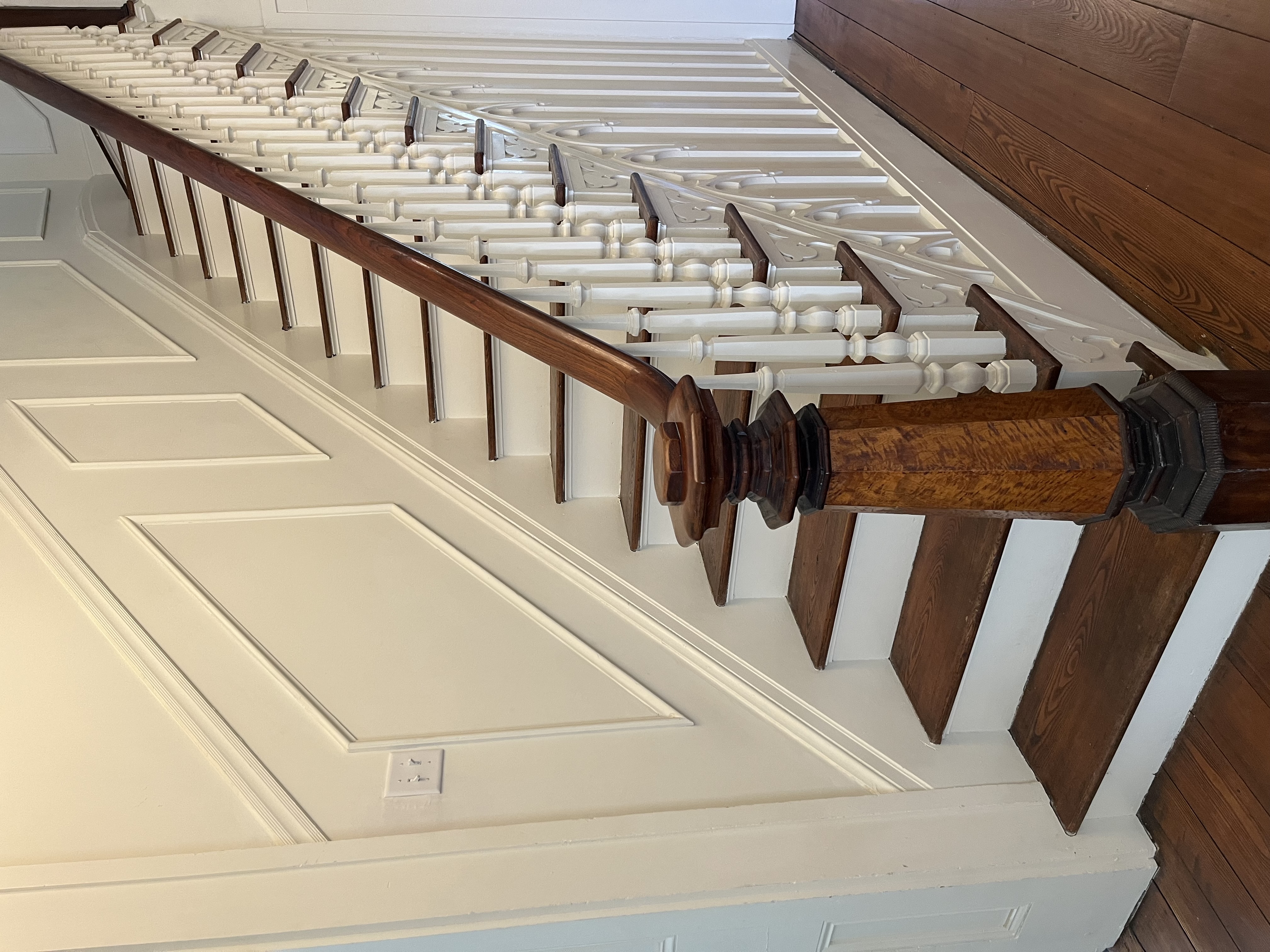 Restored original staircase with ornate turned-wood baluster detail
